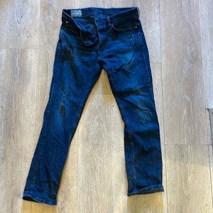 Men’s blue jeans lightly distressed